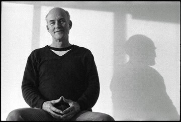 Robert Irwin sitting before a white background with light gray shadows