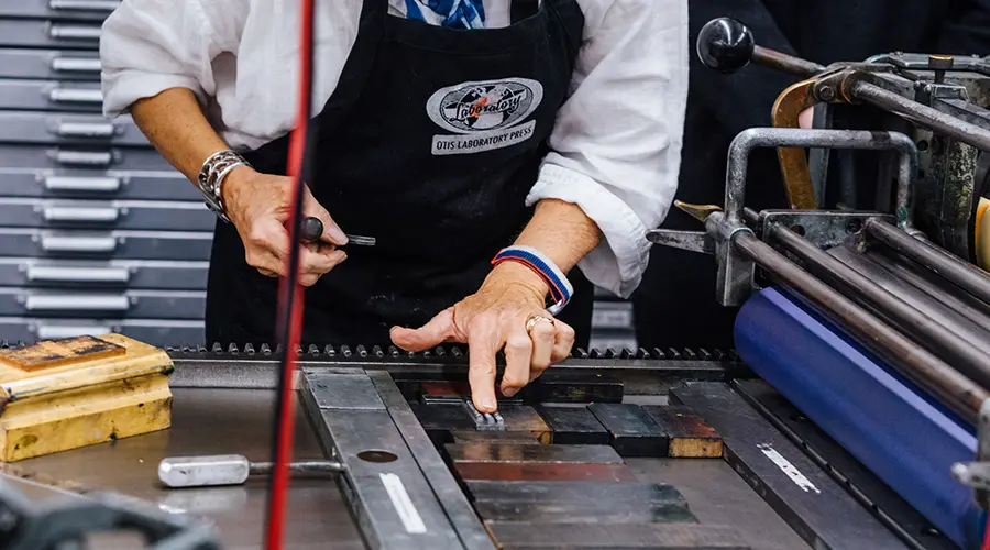 Person setting letters in the Laboratory Press