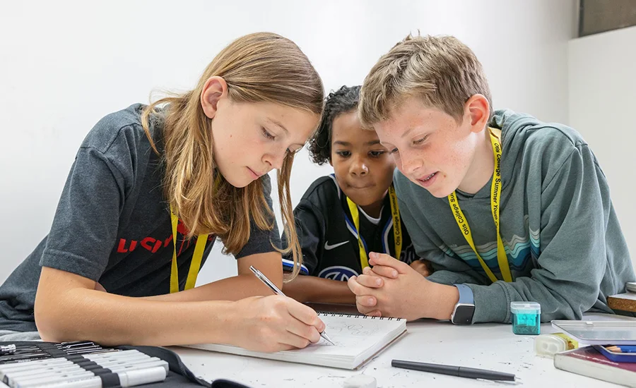 Students working collectively on art