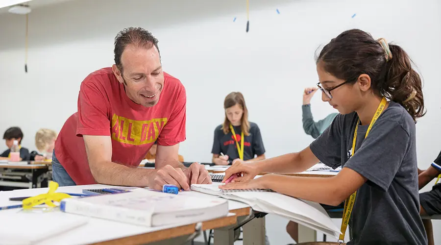 Instructor Enoch Davis working with student