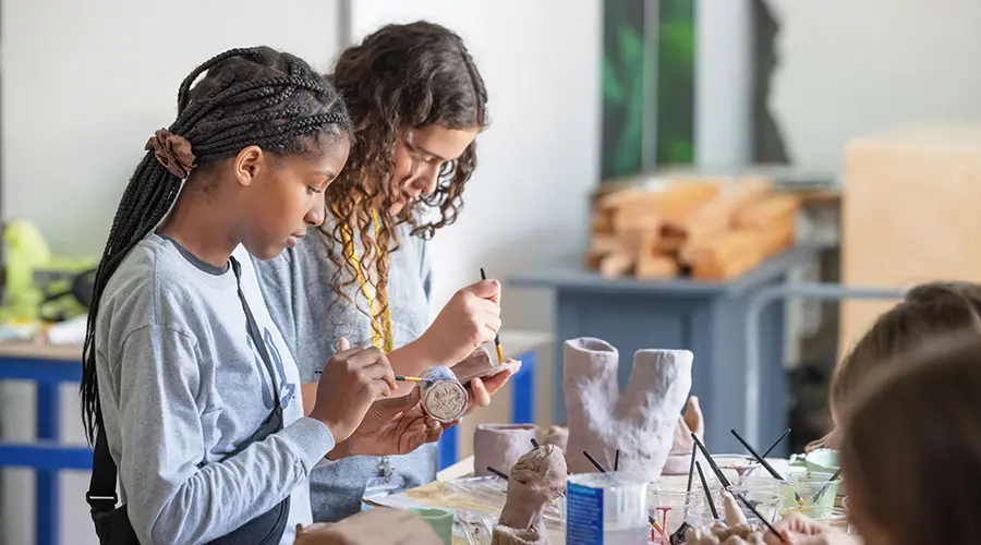 Young students in ceramics class