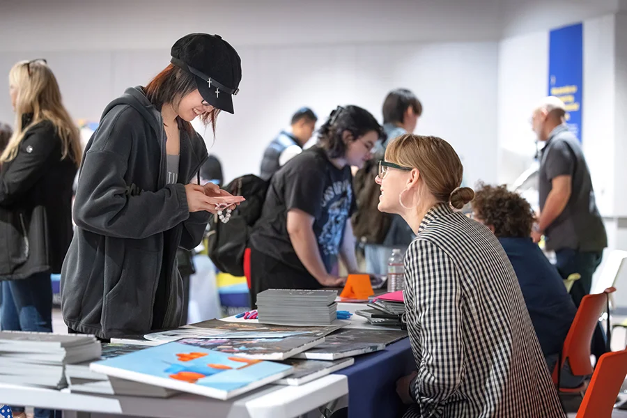 Otis College Executive Director of Admissions Pathways, Courtney Richter, right, meets with a student during National Portfolio Day. Photograph by Sarah Galonka/Otis College of Art and Design.