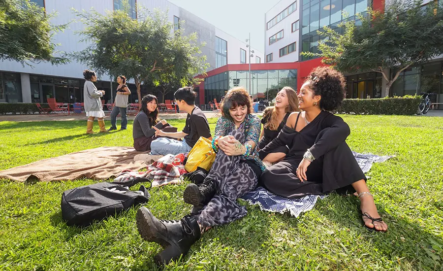 Otis College students on the Commons lawn, located in front of the Residence Hall.