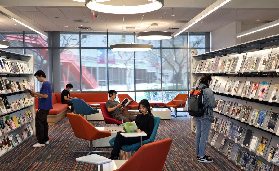 Students reading books in a library