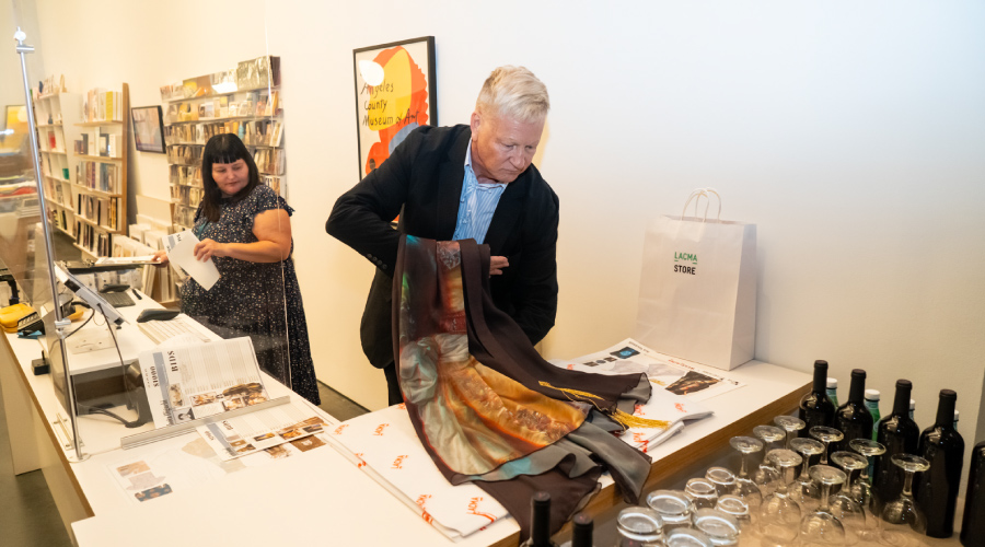 Breding wraps up a purchase from the Wear LACMA auction. Photograph by Andre Hylton/Otis College of Art and Design.