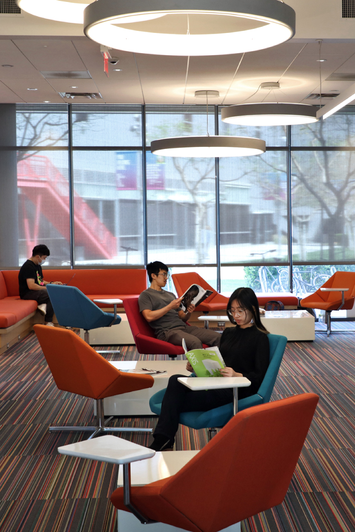 Students reading books in a library