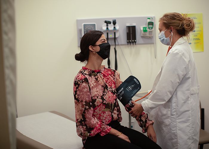 Dr. Spencer treating a student at the Student Health and Wellness Center at Otis College. 