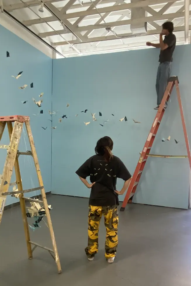 students setting up the Van Sant gallery