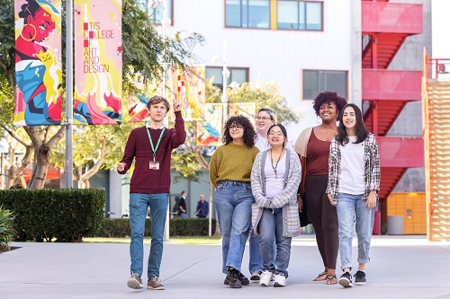 Six students walking across campus