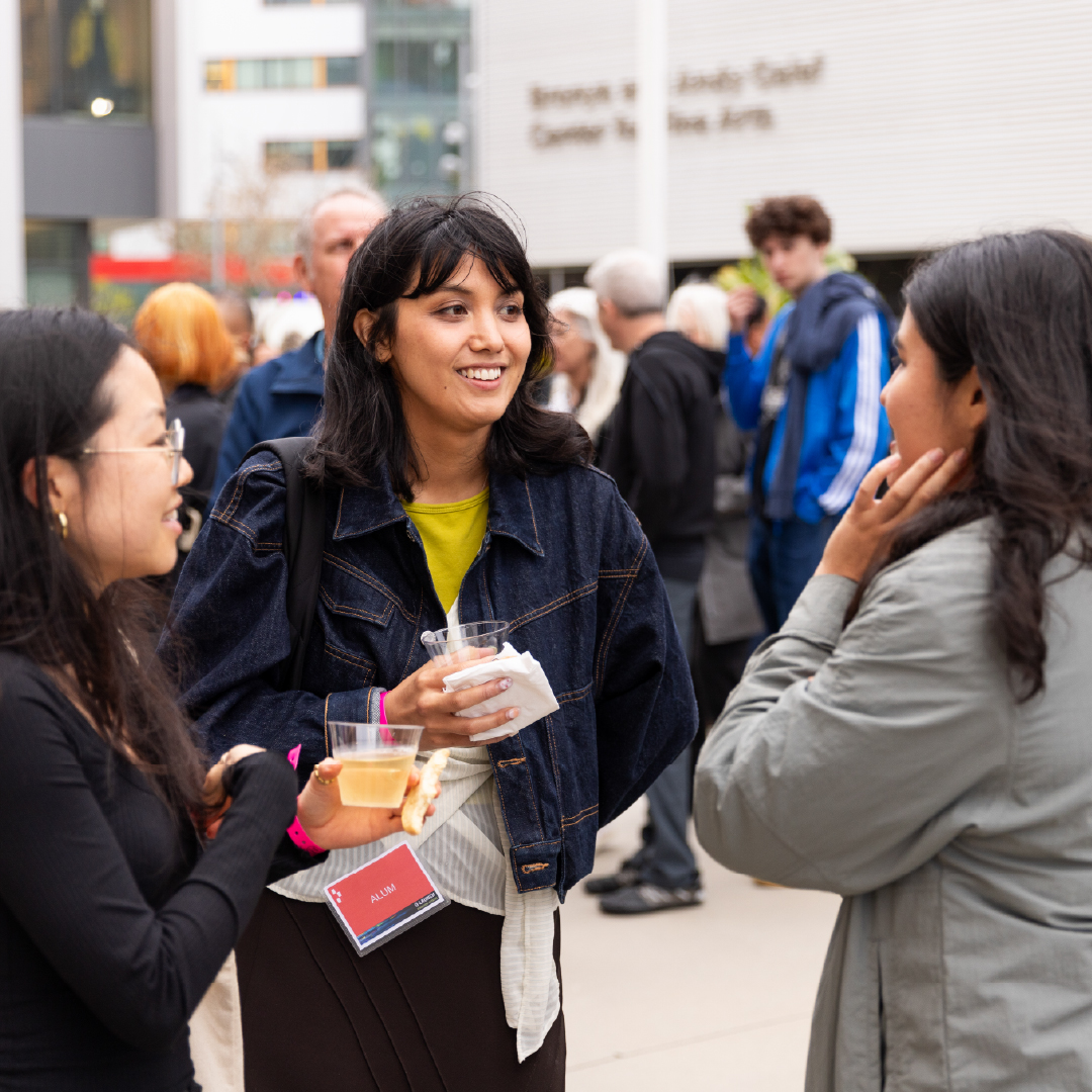 Alumni at reception talking 