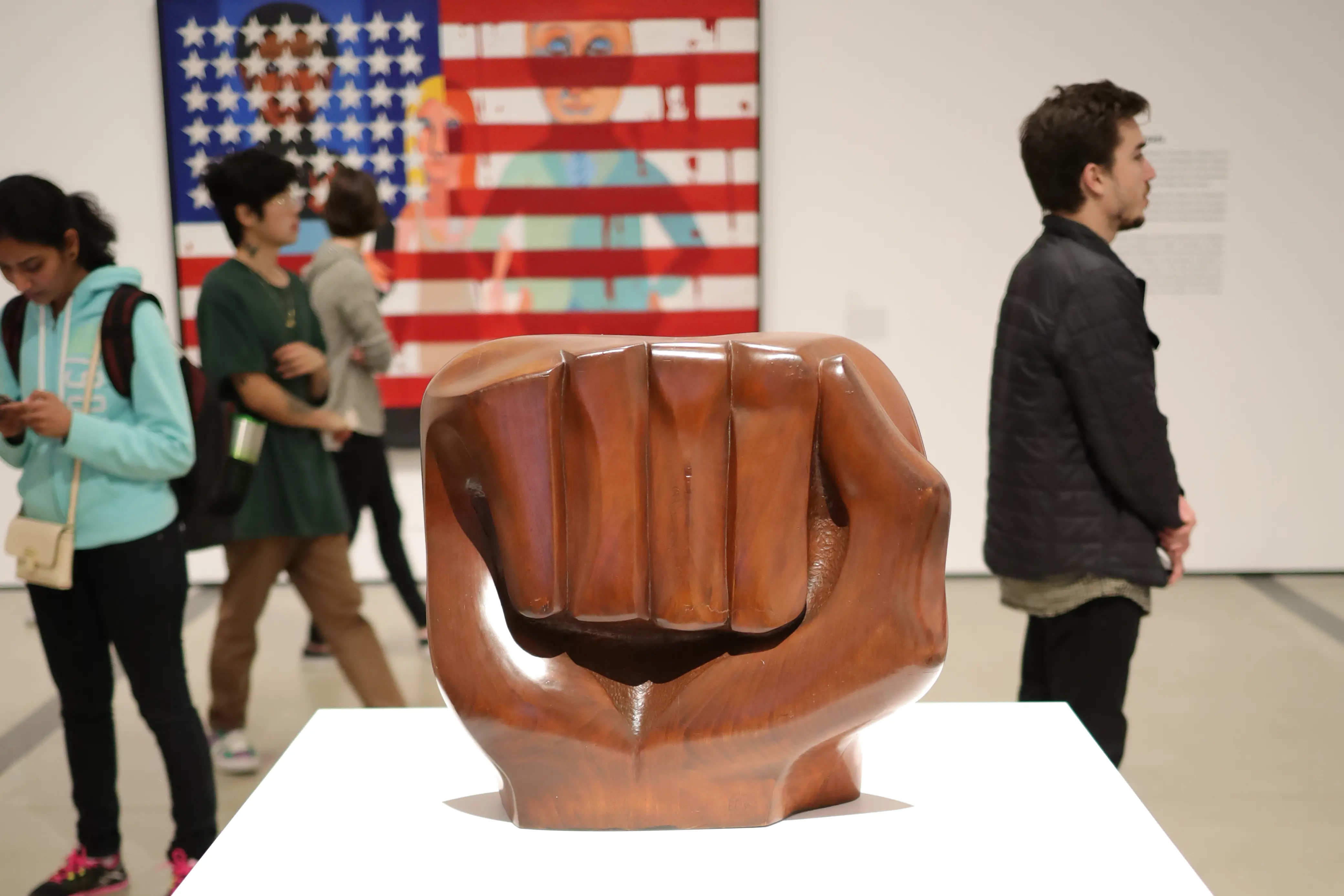 Sculpture of Fist in front of American flag