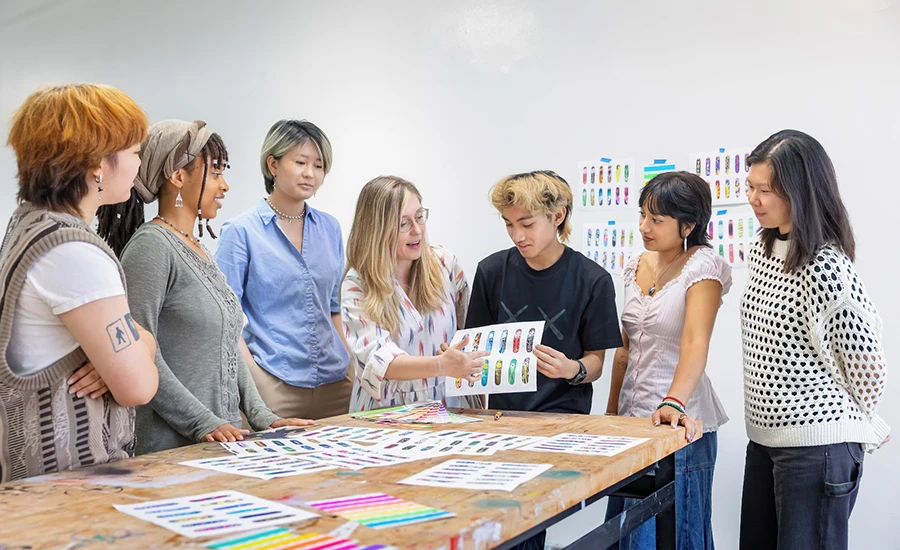 Emily Carlson, center, works with Design Lab students on their designs for World of Hurt. Photograph by Sarah Golonka/Otis College of Art and Design.