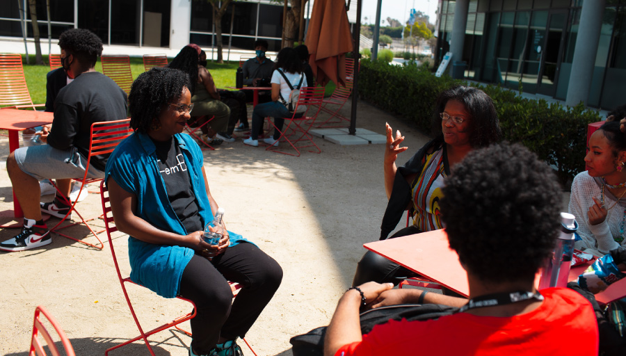 An Otis College peer advisor speaks with Black Creatives Institute participants during a field trip last summer. Photograph by Jennifer Atalla/Otis College of Art and Design. 