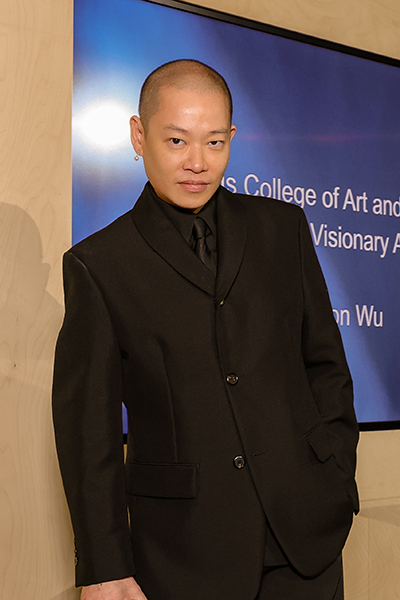 Fashion designer Jason Wu stands with the Creative Visionary Award from Otis College of Art and Design.