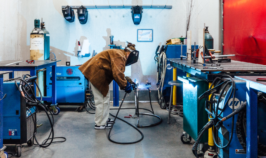 Woman welding metal