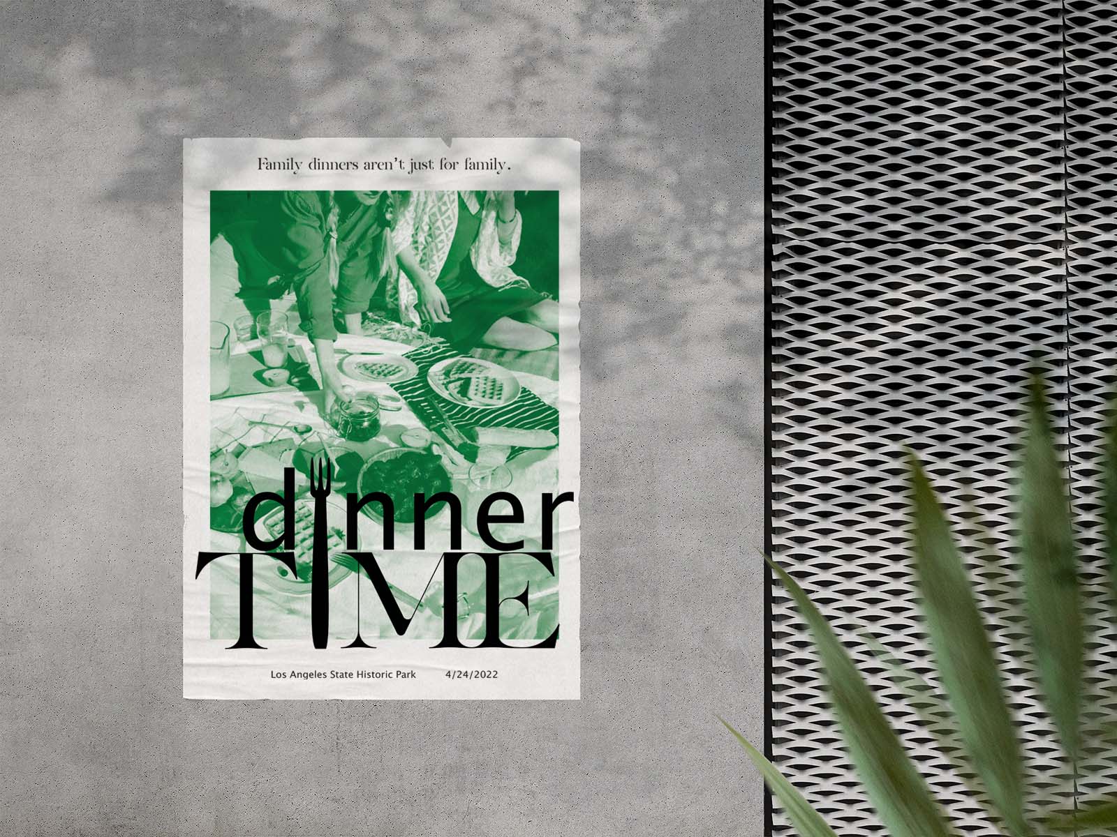A poster mounted on a concrete wall for a food event titled Dinner Time.