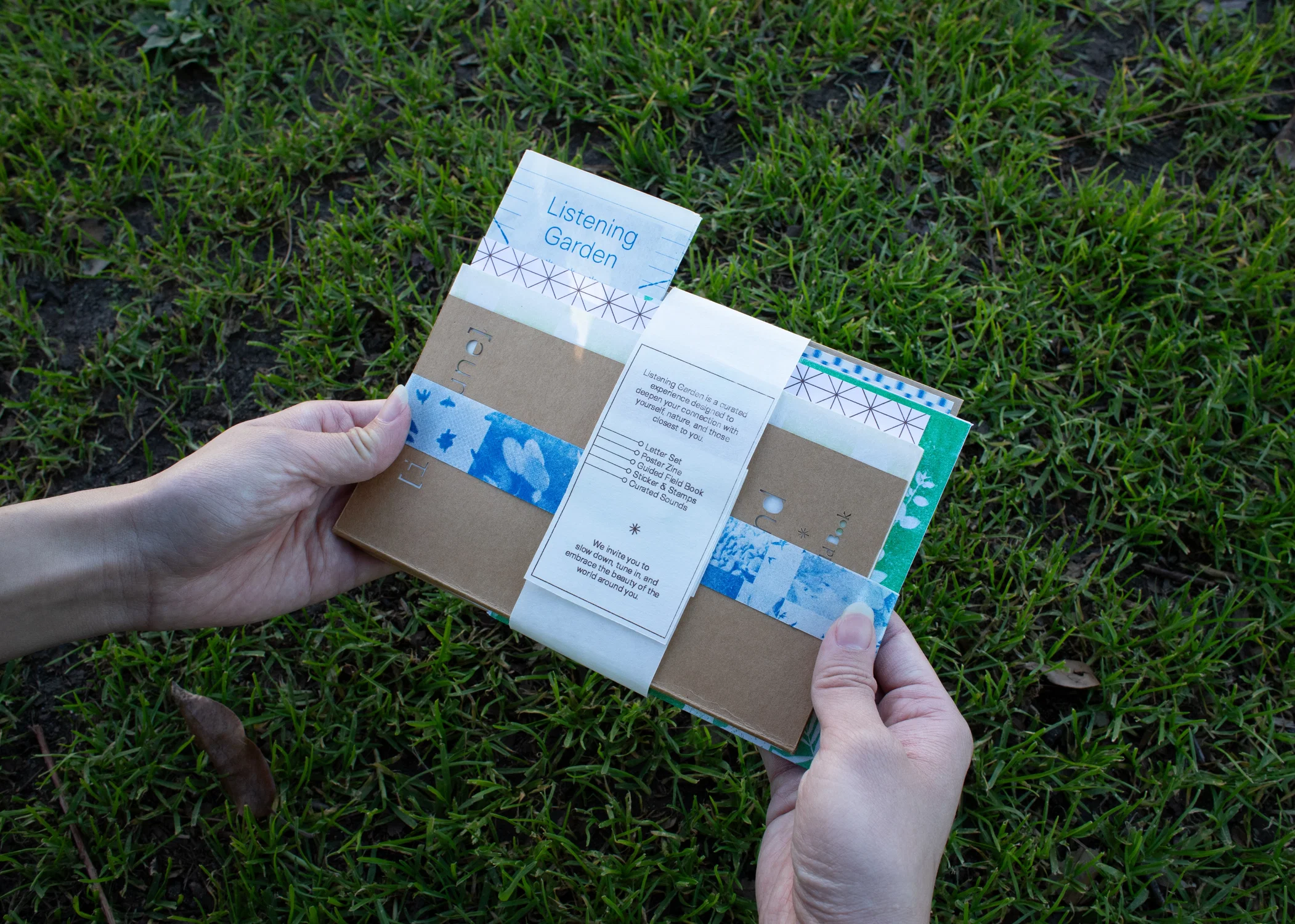 Listening Garden is an intimate sound + reflection experience split into two interactive parts: Attuning & Immersing. The experience is focused on being in tune with your mind, body, and sound. The kit includes a guided field book, a poster zine, two letter sets, sticker & stamps, and a curated soundscape disc.