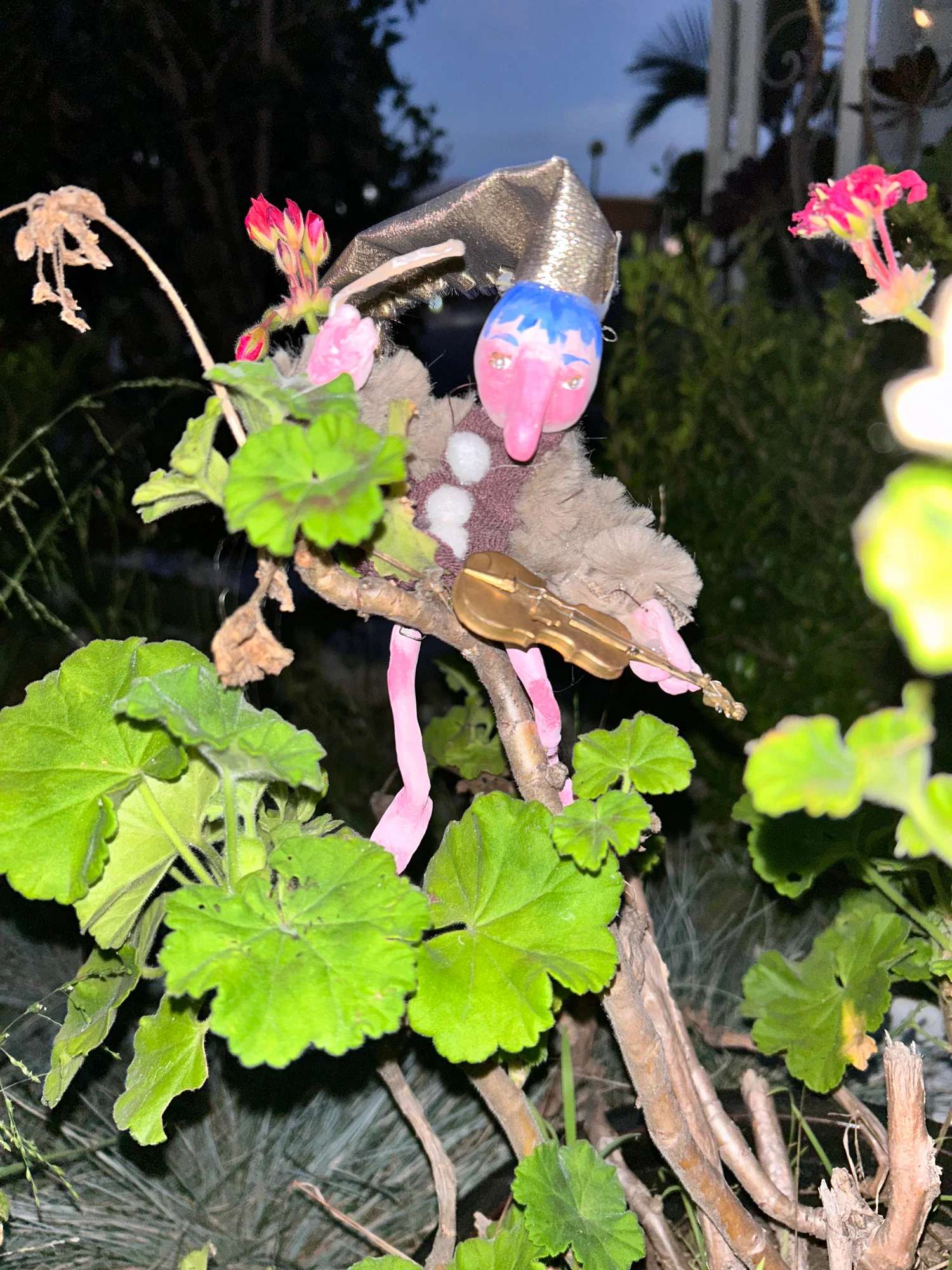 A fantastical elf guy with blue hair, frollicking through the foliage at night playing his magical golden violin.