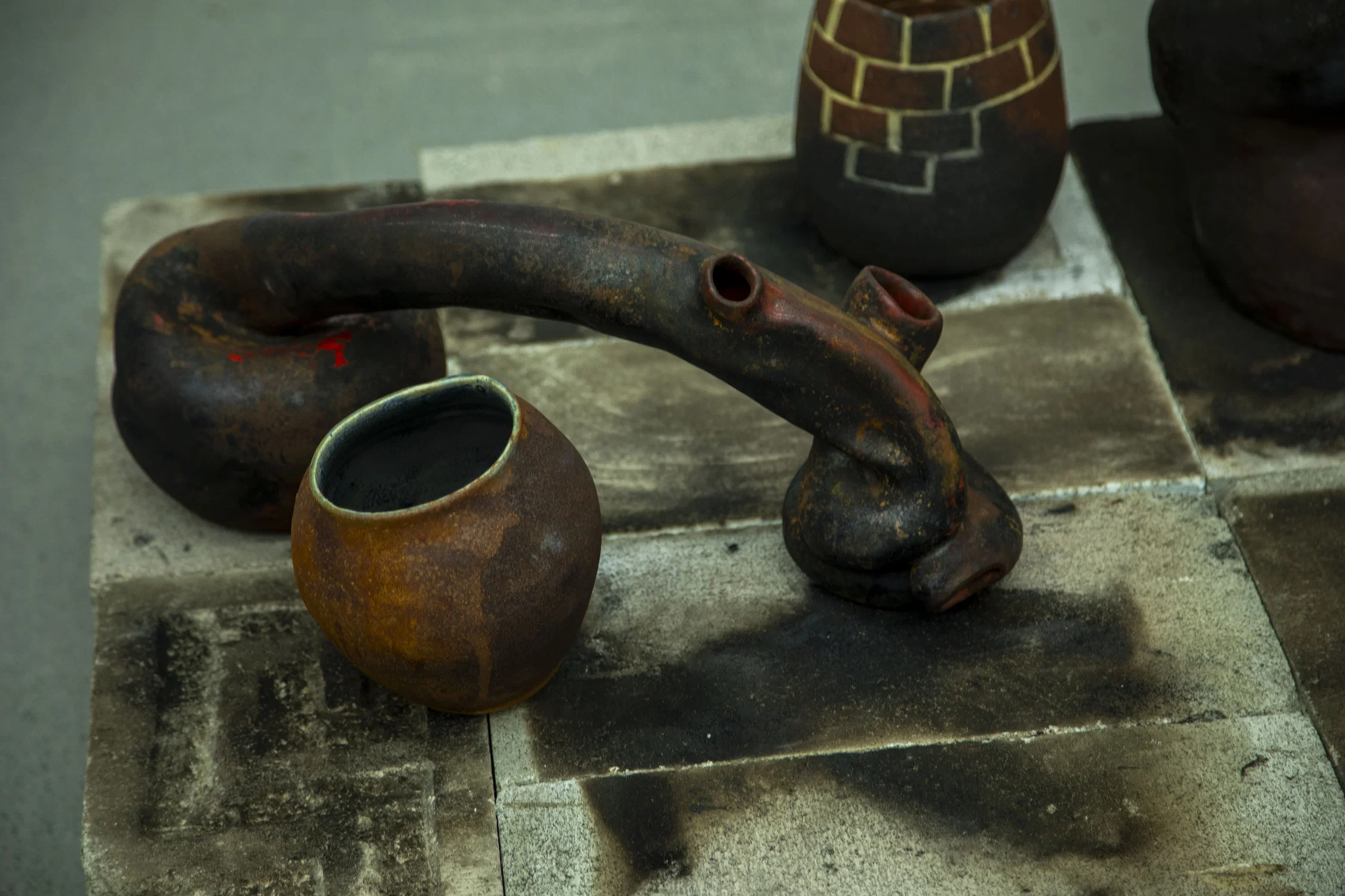 Photograph of a series of rusty pots.