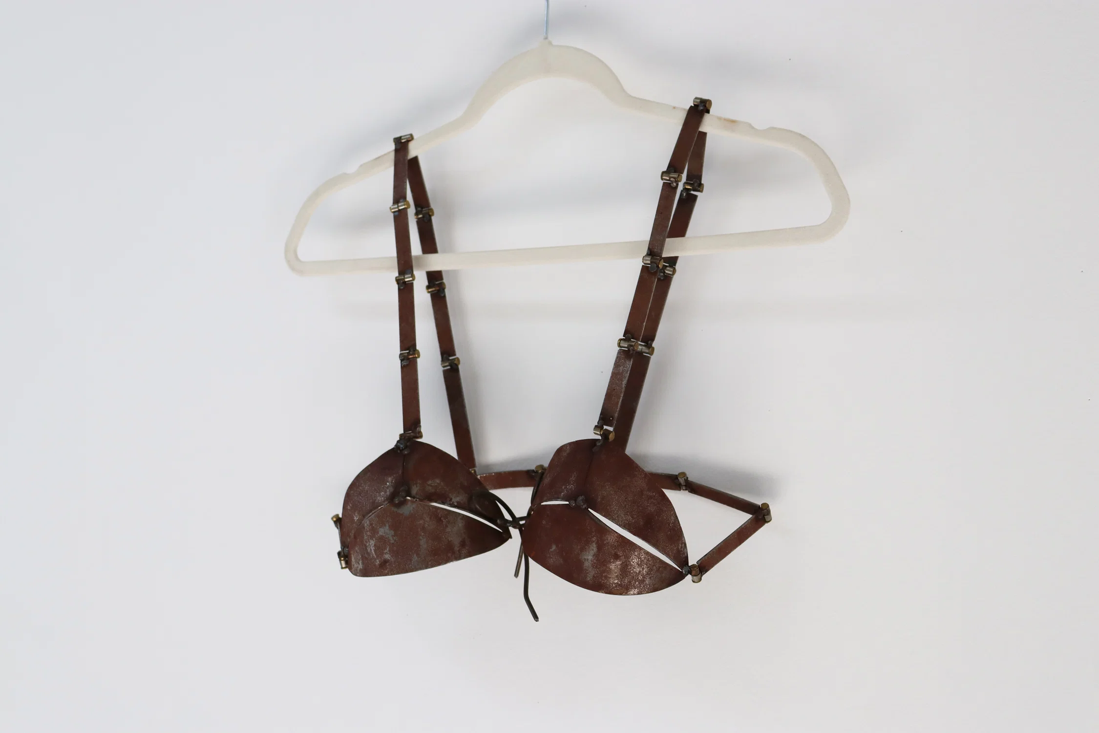 28b, 2025 Steel, brass, hanger 24 in x 18 in on wall