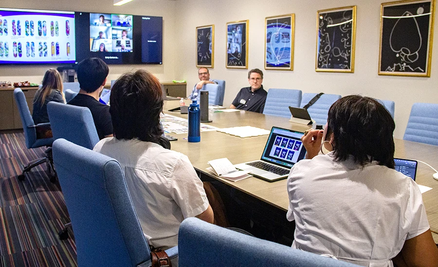 Design Lab designers meeting with World of Hurt clients.