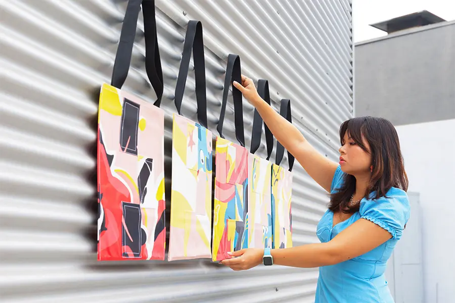 Upcycled tote bags hanging display