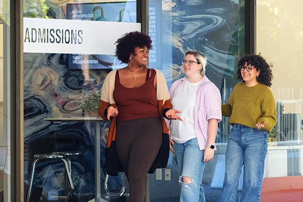 Student and administrator in combuter lab