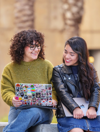 Two students at a laptop together