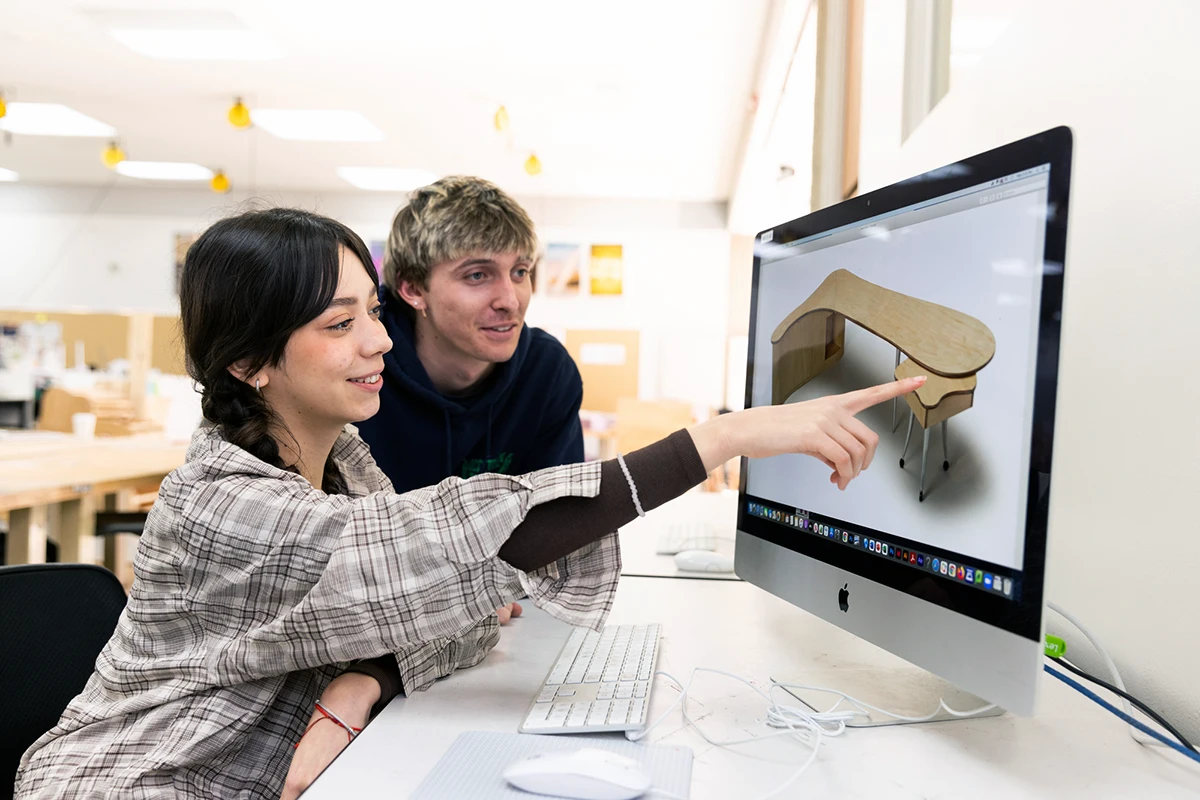 Students discussing furniture on screen