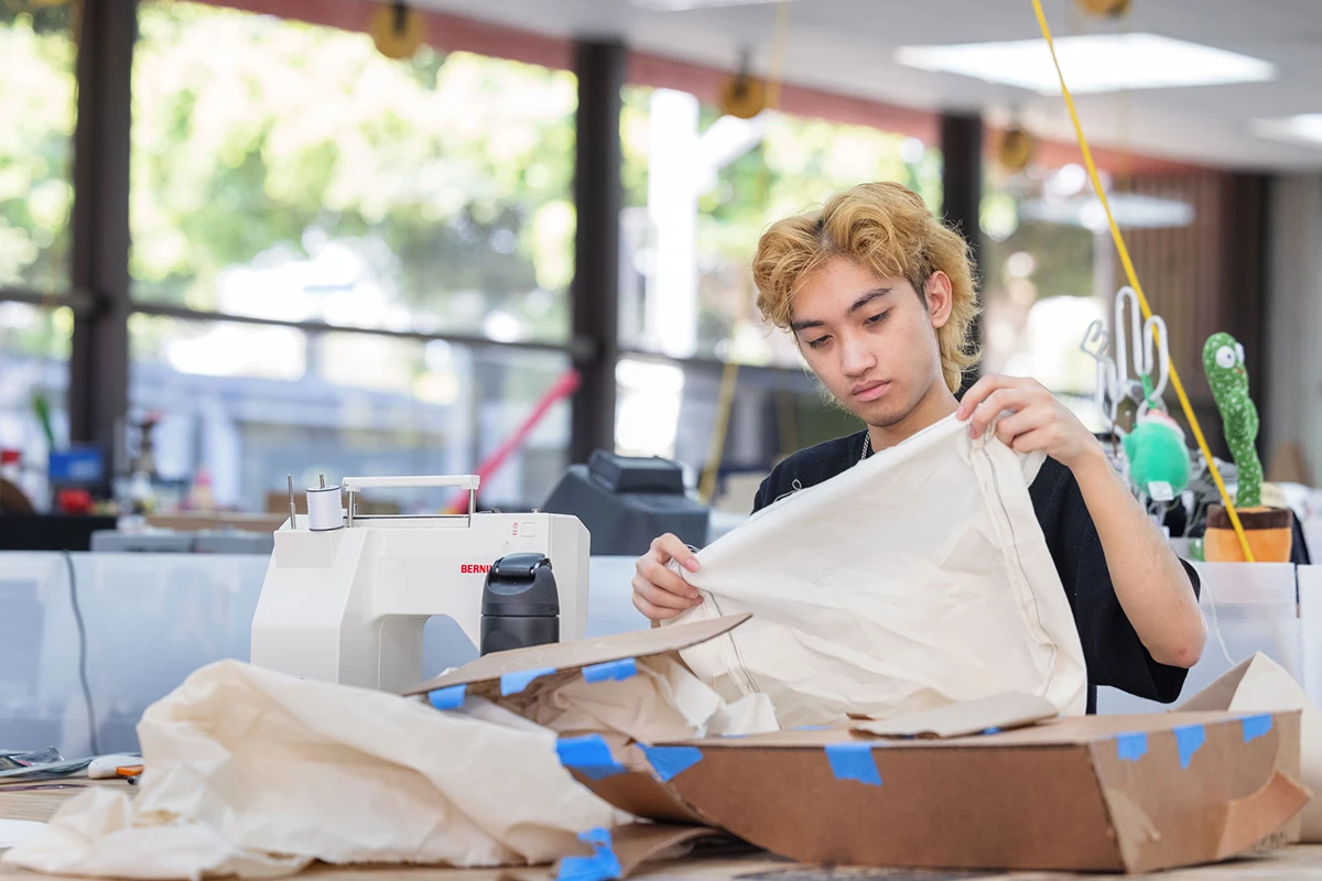 Student working with Fabric