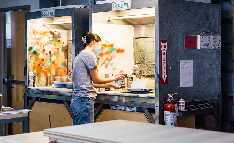 Student painting a model