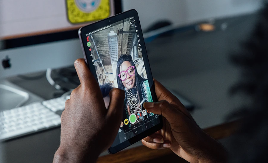 Student testing out Snap Lens project on tablet