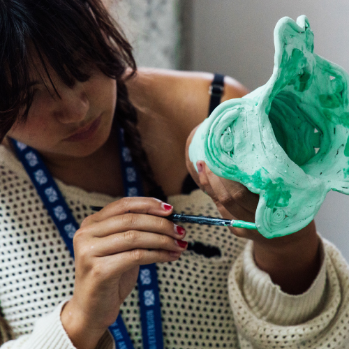 Summer of Art student working on pottery piece