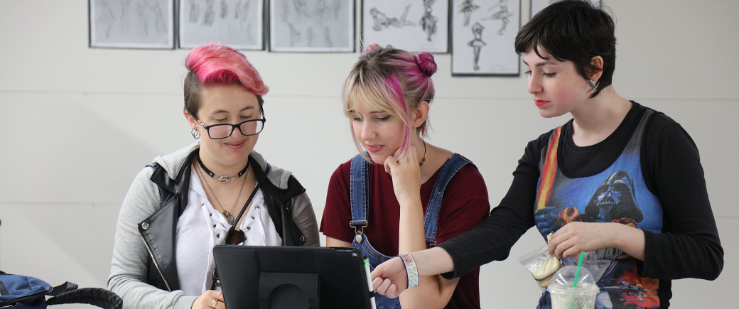 Young students looking at screen