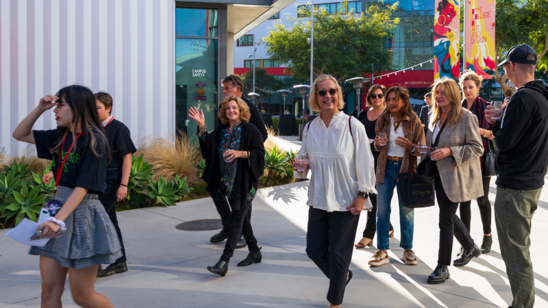 Guests walking by on campus during Notice Otis event