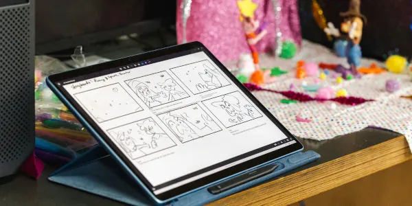 Tablet computer with 6 storyboard sketches next to a stop-action animation setup