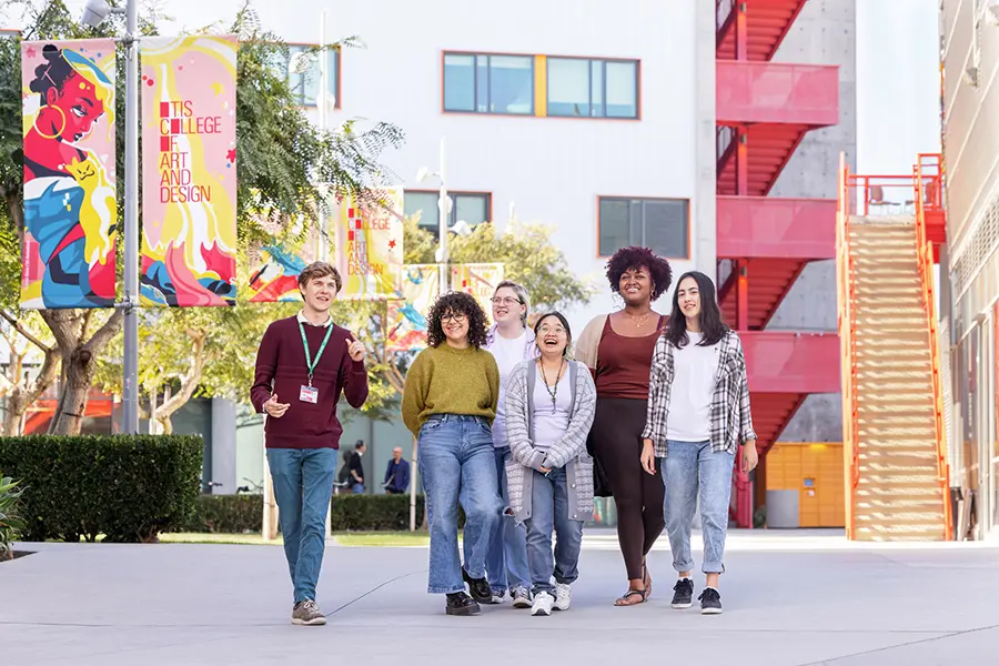 Campus Banners by Genisis Otero, with students walking in the Commons