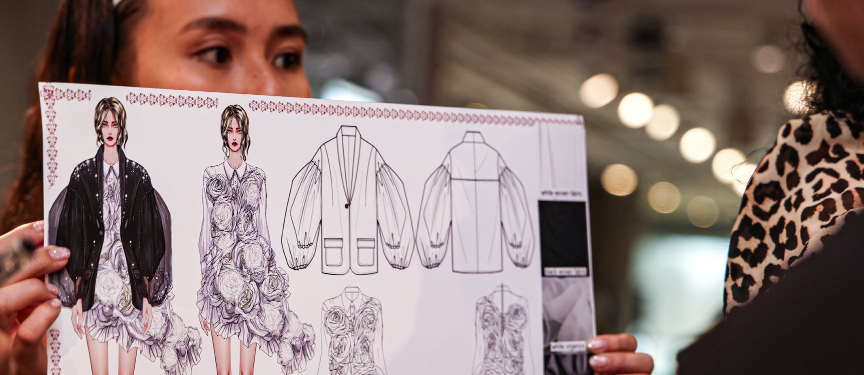Fashion design student presenting a sketch