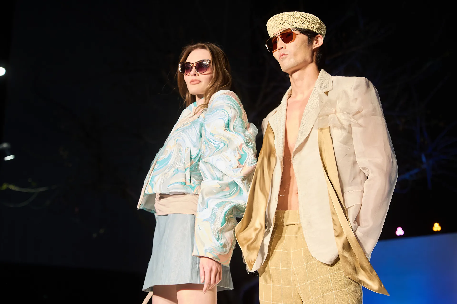 Models showing light colored summer wear