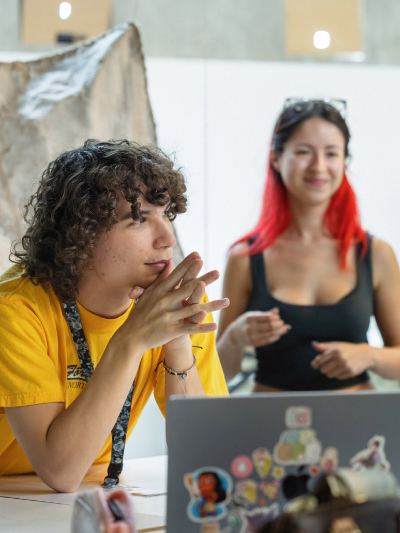 Students talking in classroom at Otis College