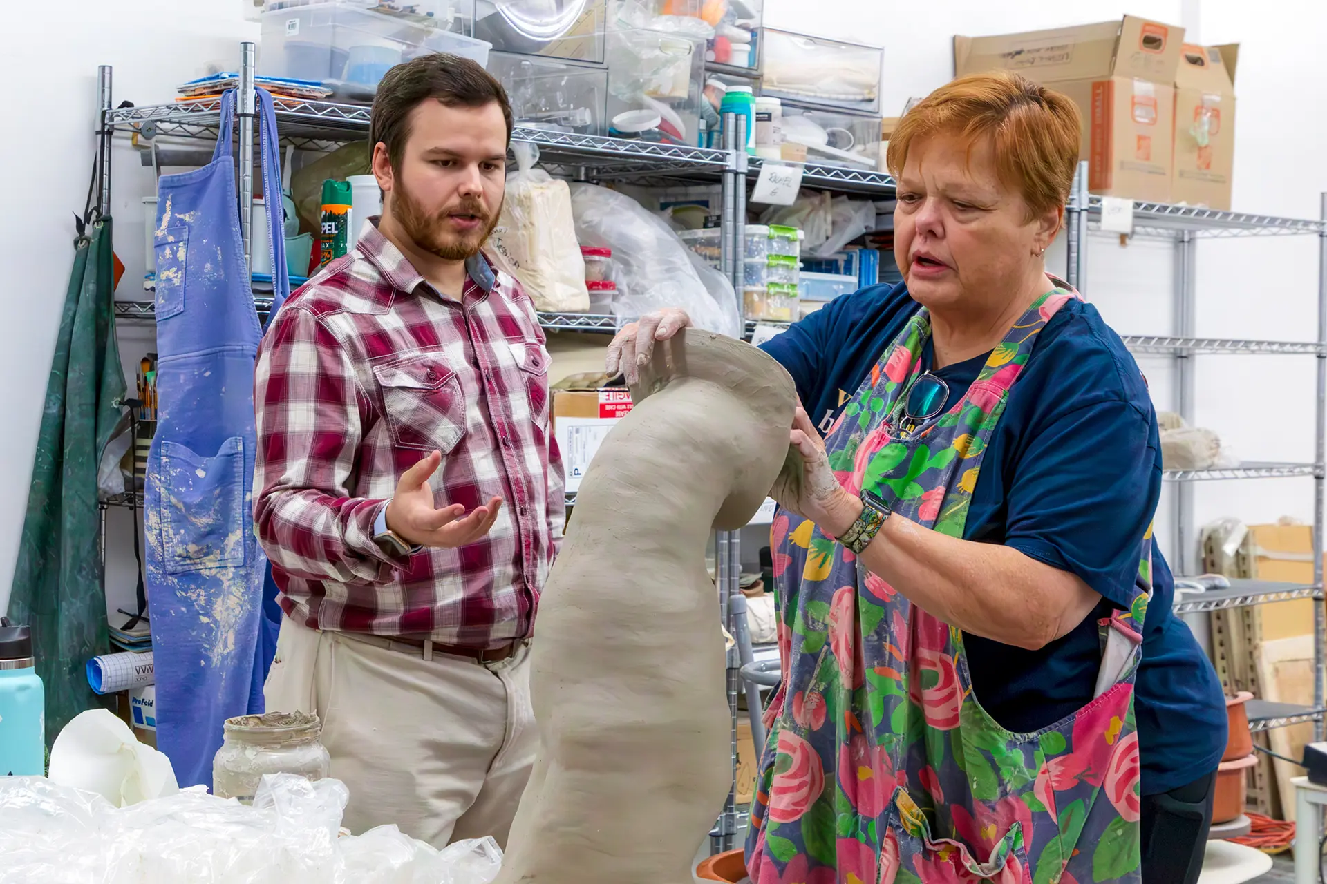 people working on sculpture