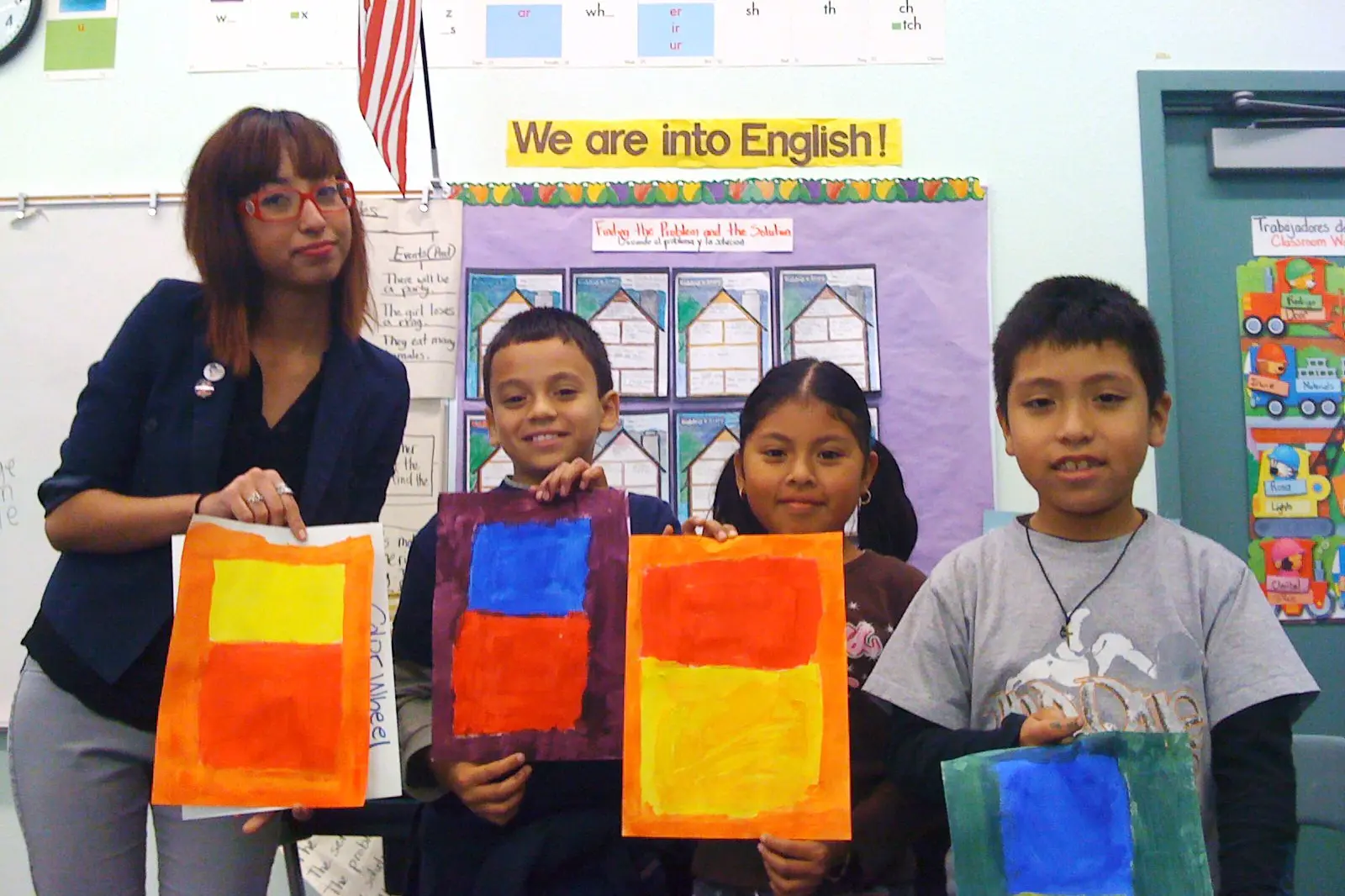 Young students showing their artwork