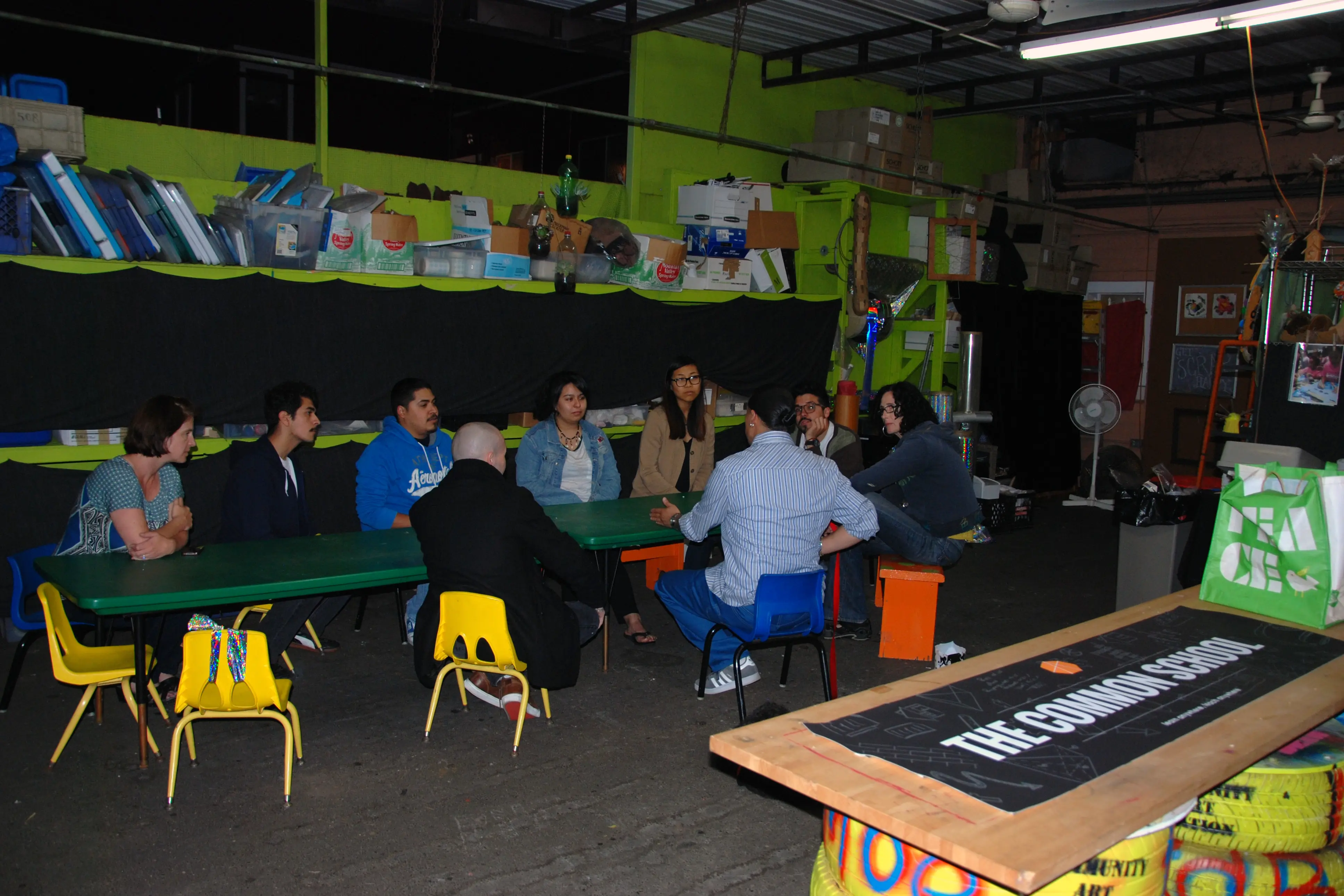 people sitting at a long table