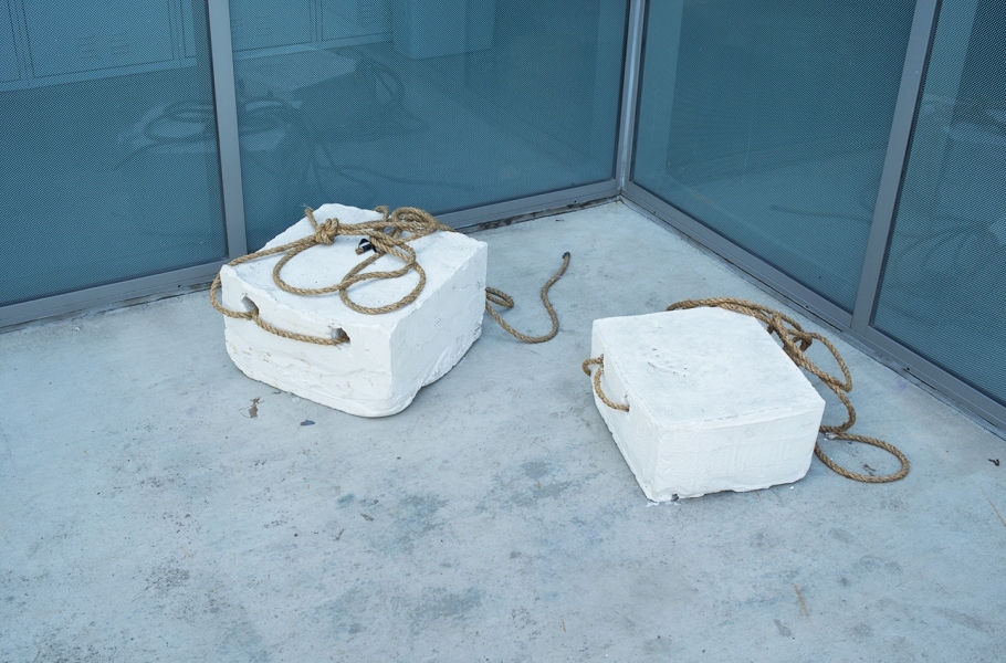 concrete blocks with rope strung through them