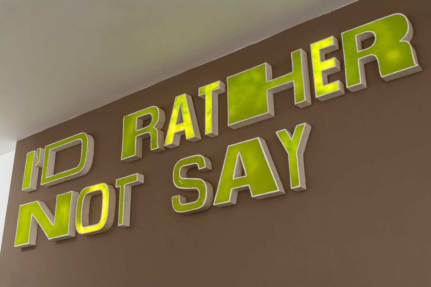 Sayer Delk artwork of letters on a wall saying "I'd rather not say"