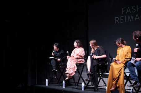 Three panelists seated at the Los Angeles Fashion Week