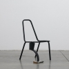 Joseph  Sherman artwork: Broken chair with one  leg  replaced by part of a basketball hoop