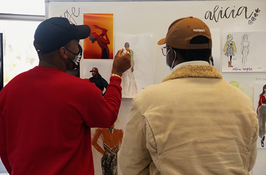 Jason Bolden reviews a Summer of Style student's work at Otis College. 