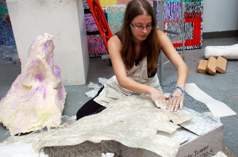 Student Astrid Georges working on the papier-mâché float