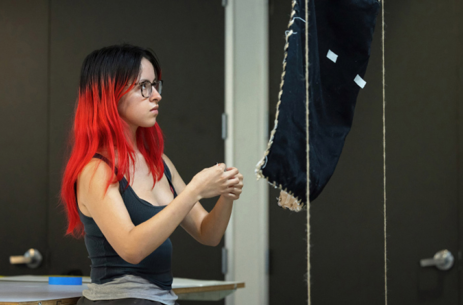 Student working with textile